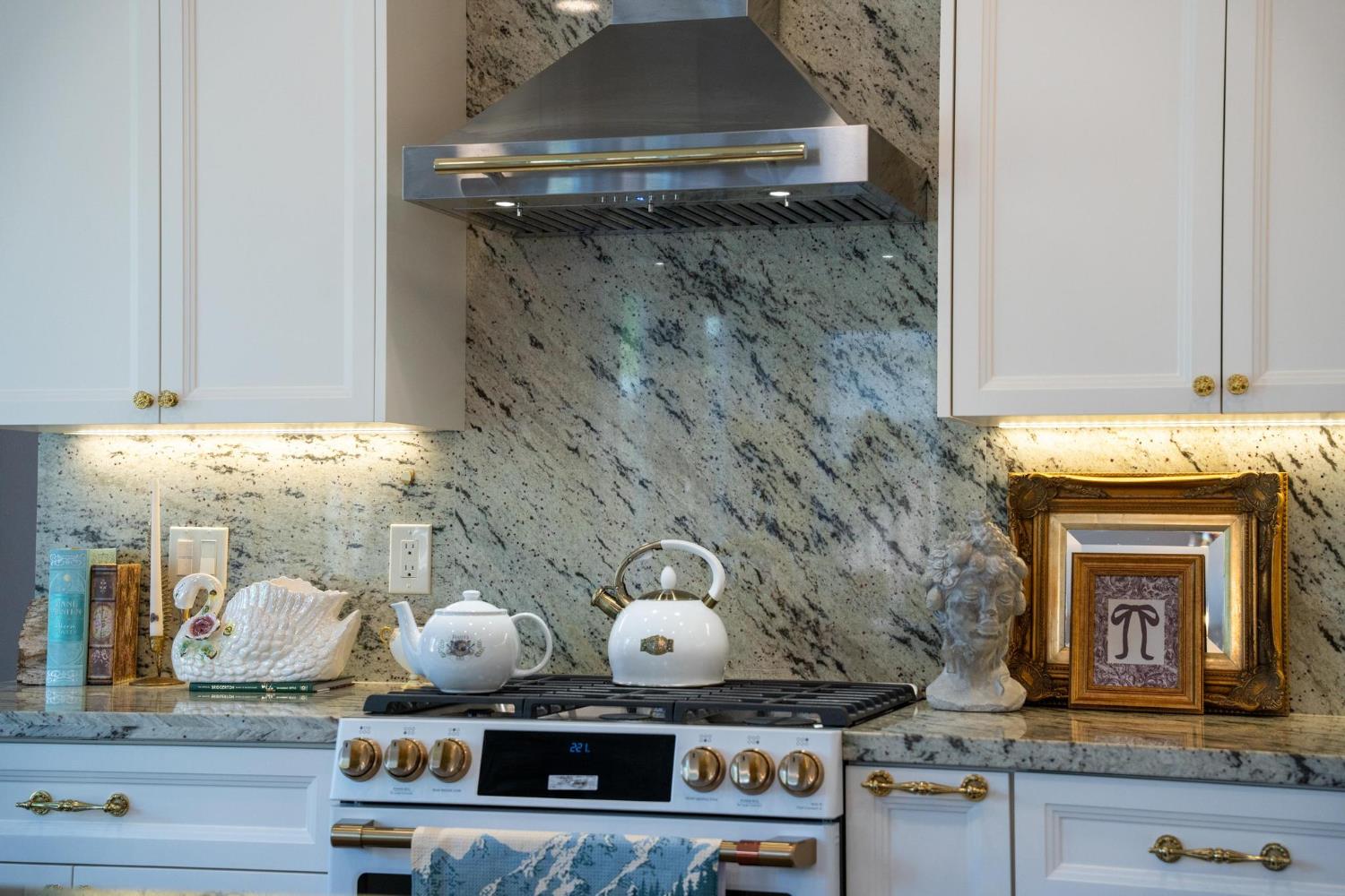 426 South Highland Avenue Ripon, CA 95366 - Photo 20 of 82 a stove top oven sitting inside of a kitchen