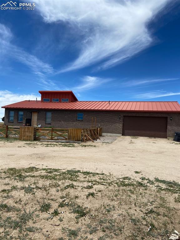 41470 Hoot Owl Road Ramah, CO 80832 - Photo 17 of 20 a front view of a house with a yard