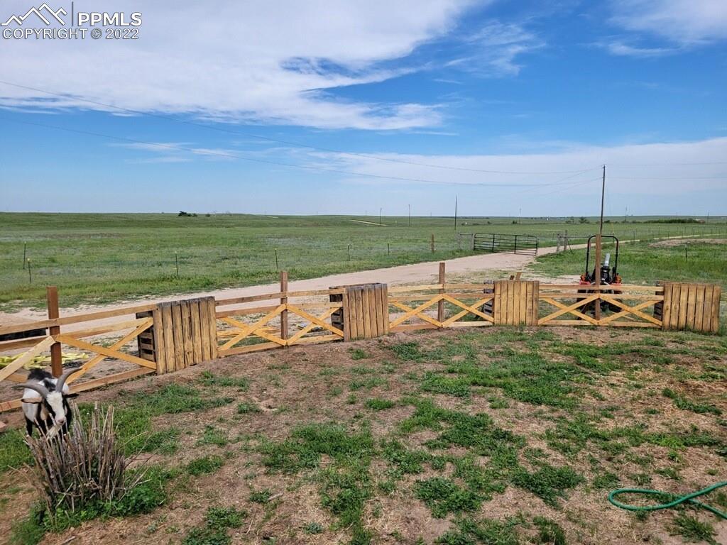 41470 Hoot Owl Road Ramah, CO 80832 - Photo 19 of 20 a view of a lake with a table and chairs