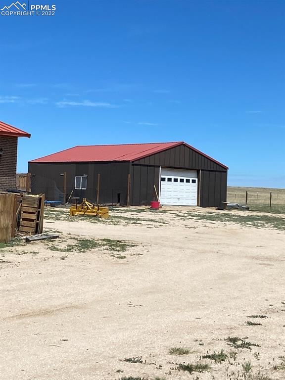 41470 Hoot Owl Road Ramah, CO 80832 - Photo 2 of 20 a front view of a house with a yard