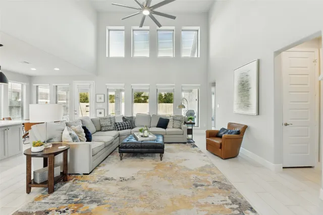 a living room with furniture fireplace and flat screen tv