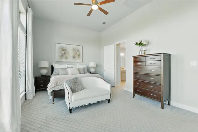 a bathroom with a double vanity sink a large mirror and a bathtub