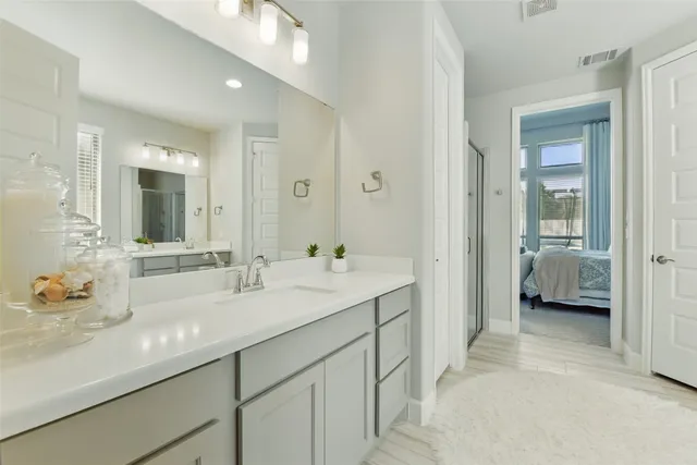a white bath tub sitting next to a white sink