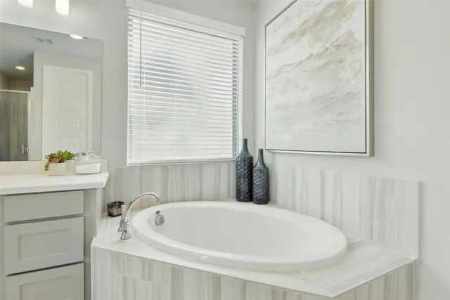 a bathroom with a glass shower door