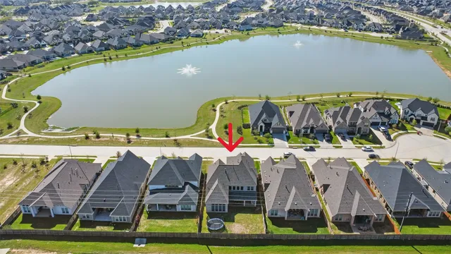 a view of swimming pool with outdoor seating and yard in the back