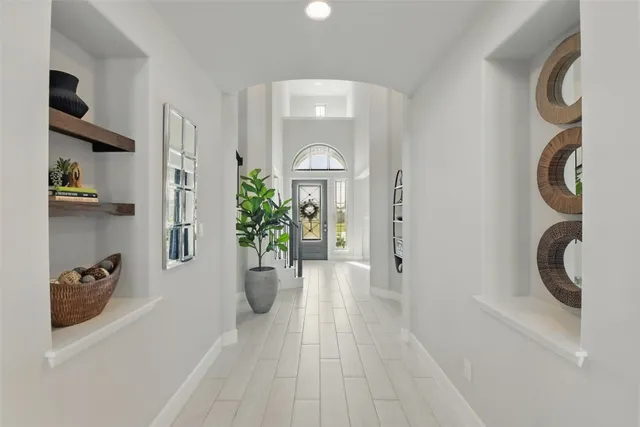 a view of a hallway view with staircase