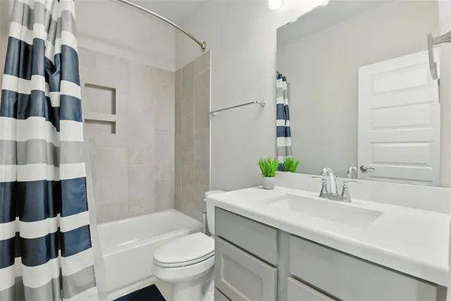 a room with a couch and chandelier