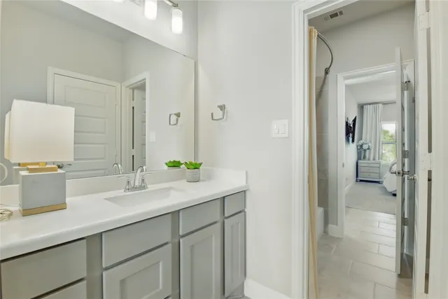 a bedroom with a large bed and a flat screen tv