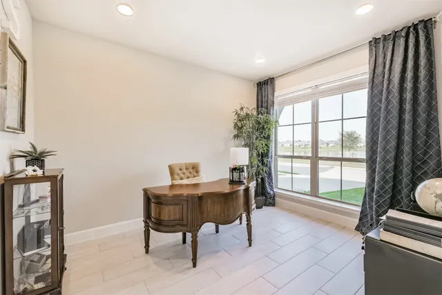 a workspace with furniture and a window