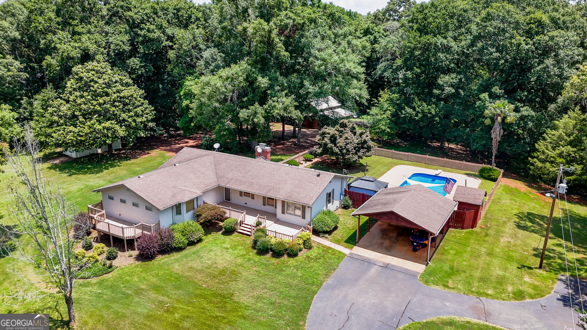 an aerial view of multiple houses with yard