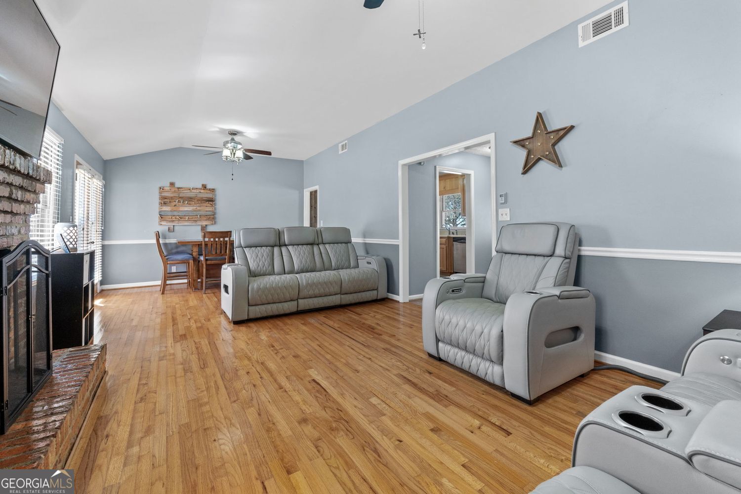 1793 Trice Cemetery Road Thomaston, GA 30286 - Photo 16 of 59 a living room with furniture and a wooden floor