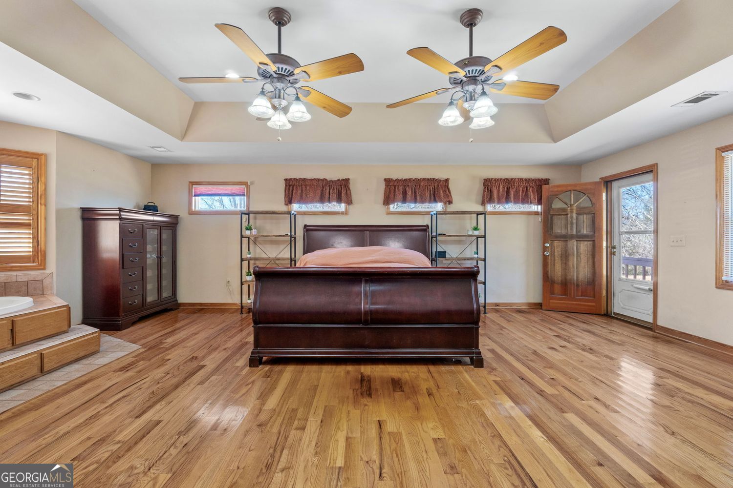 1793 Trice Cemetery Road Thomaston, GA 30286 - Photo 20 of 59 a bedroom with furniture and a chandelier fan
