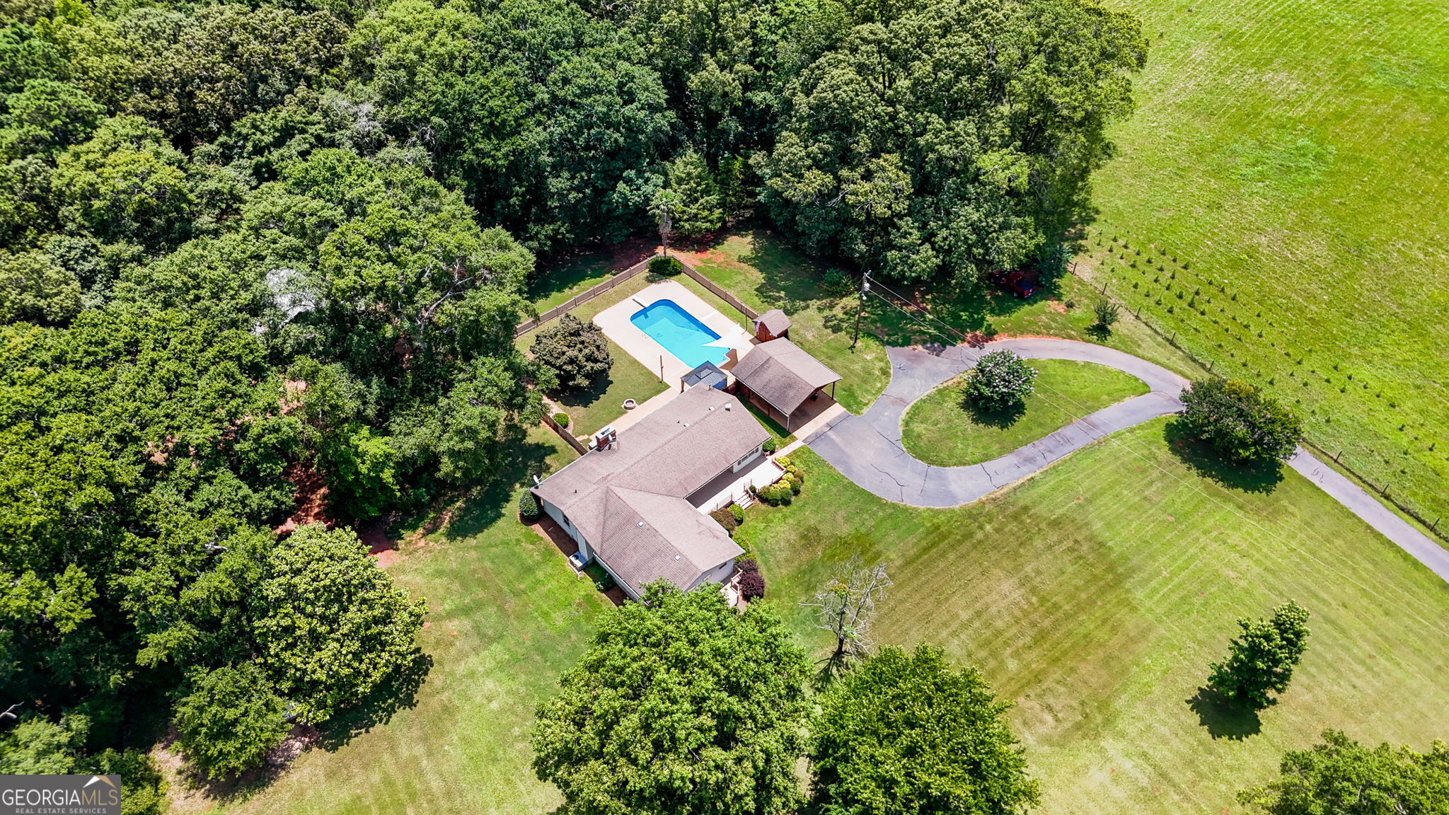 1793 Trice Cemetery Road Thomaston, GA 30286 - Photo 3 of 59 an aerial view of a house with a yard and trees