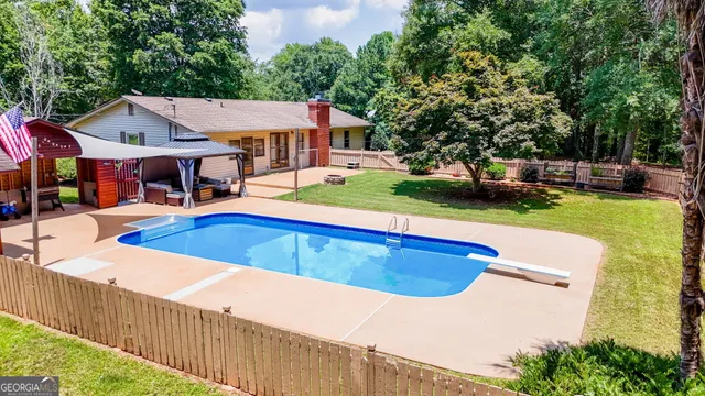 an aerial view of residential house with outdoor space