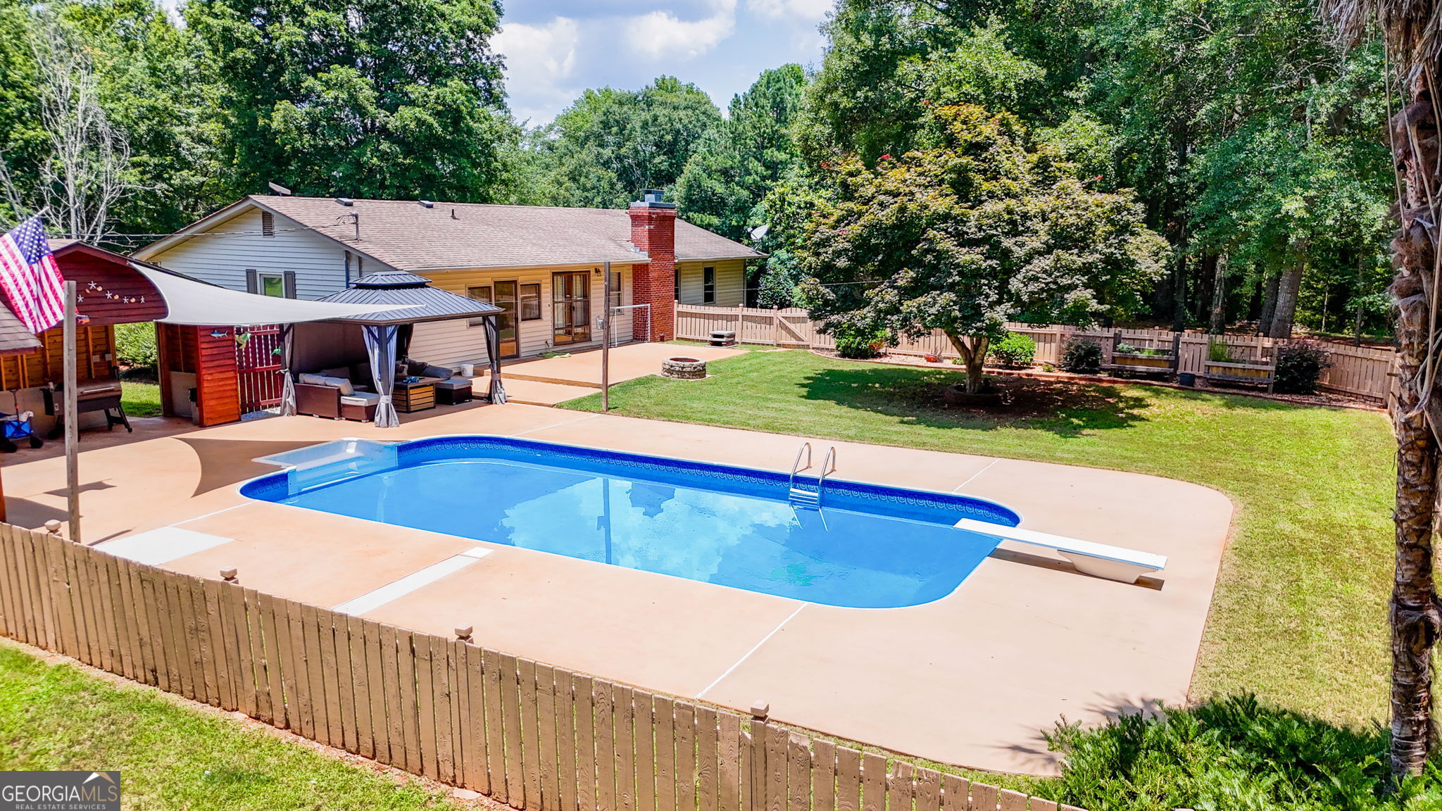 1793 Trice Cemetery Road Thomaston, GA 30286 - Photo 36 of 59 a view of a house with swimming pool and sitting area