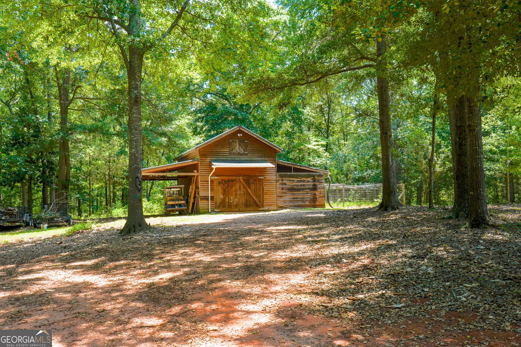 1793 Trice Cemetery Road Thomaston, GA 30286 - Photo 45 of 59 a front view of a house with a yard and trees
