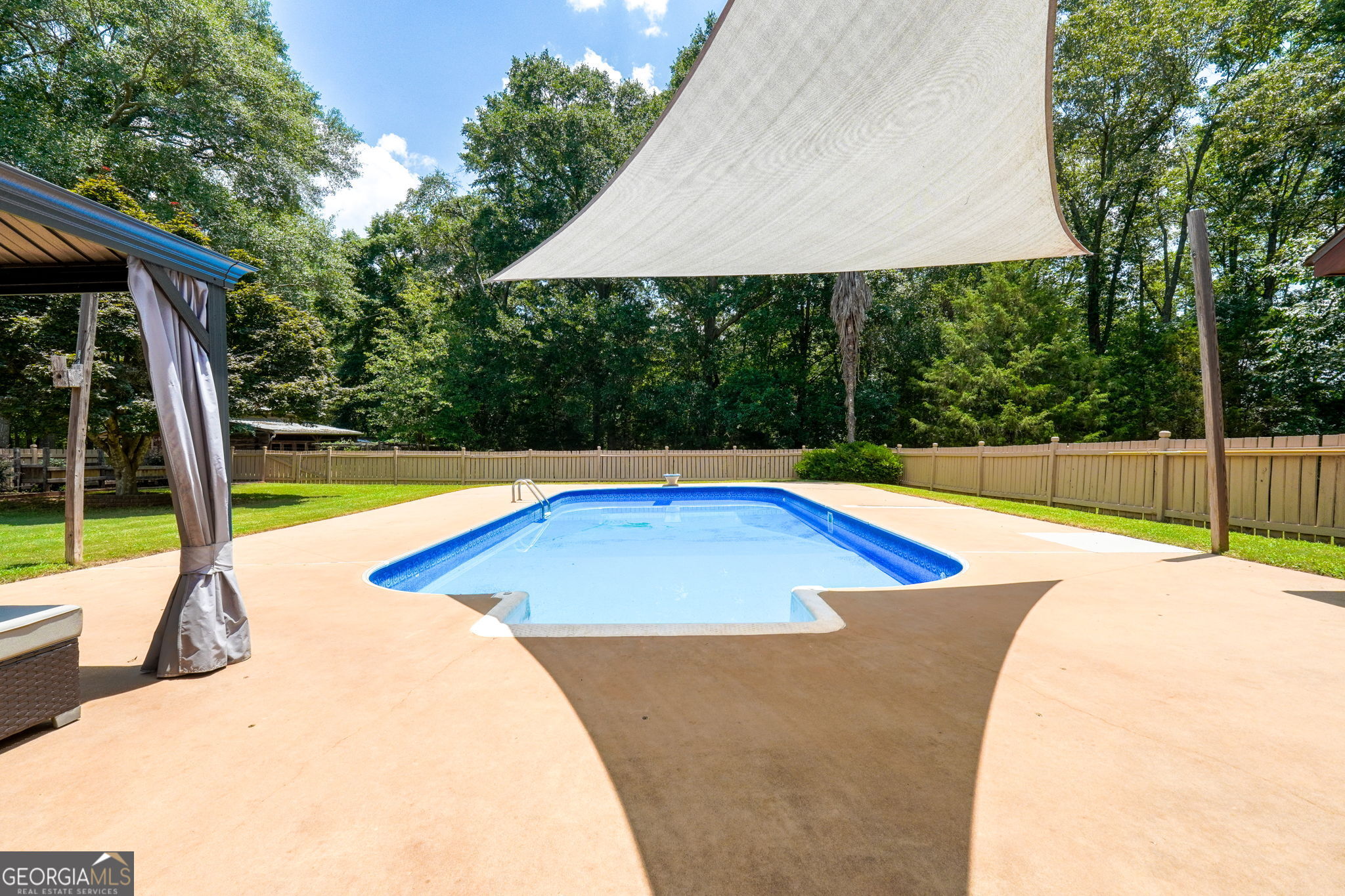1793 Trice Cemetery Road Thomaston, GA 30286 - Photo 52 of 59 a view of a backyard with swimming pool