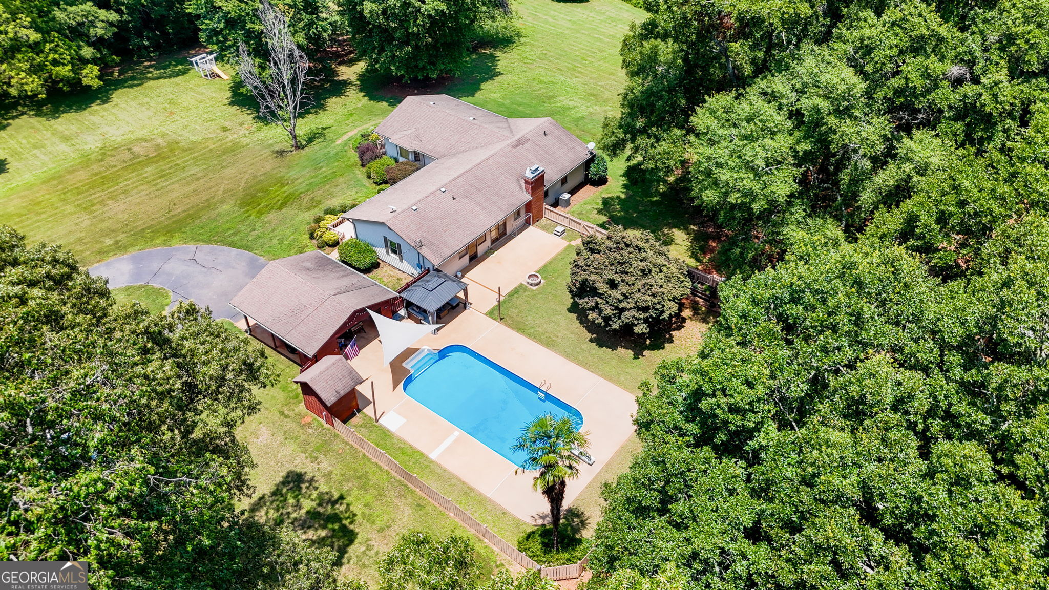 1793 Trice Cemetery Road Thomaston, GA 30286 - Photo 6 of 59 an aerial view of house with yard swimming pool and outdoor seating