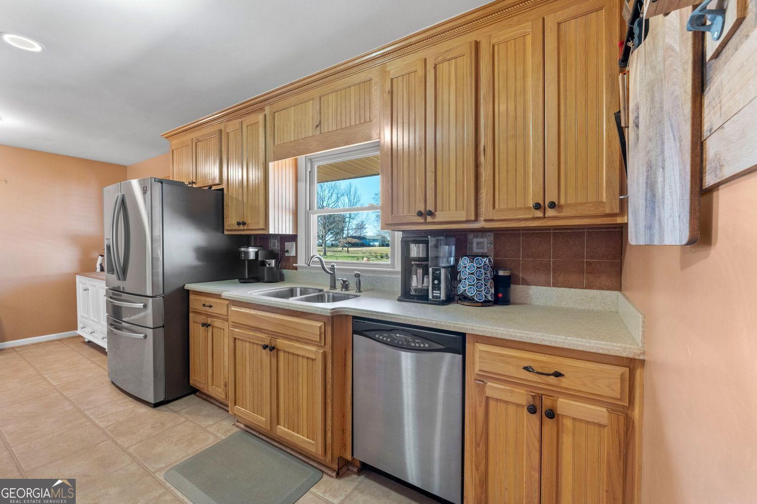 1793 Trice Cemetery Road Thomaston, GA 30286 - Photo 9 of 59 a kitchen with stainless steel appliances granite countertop a refrigerator sink and cabinets
