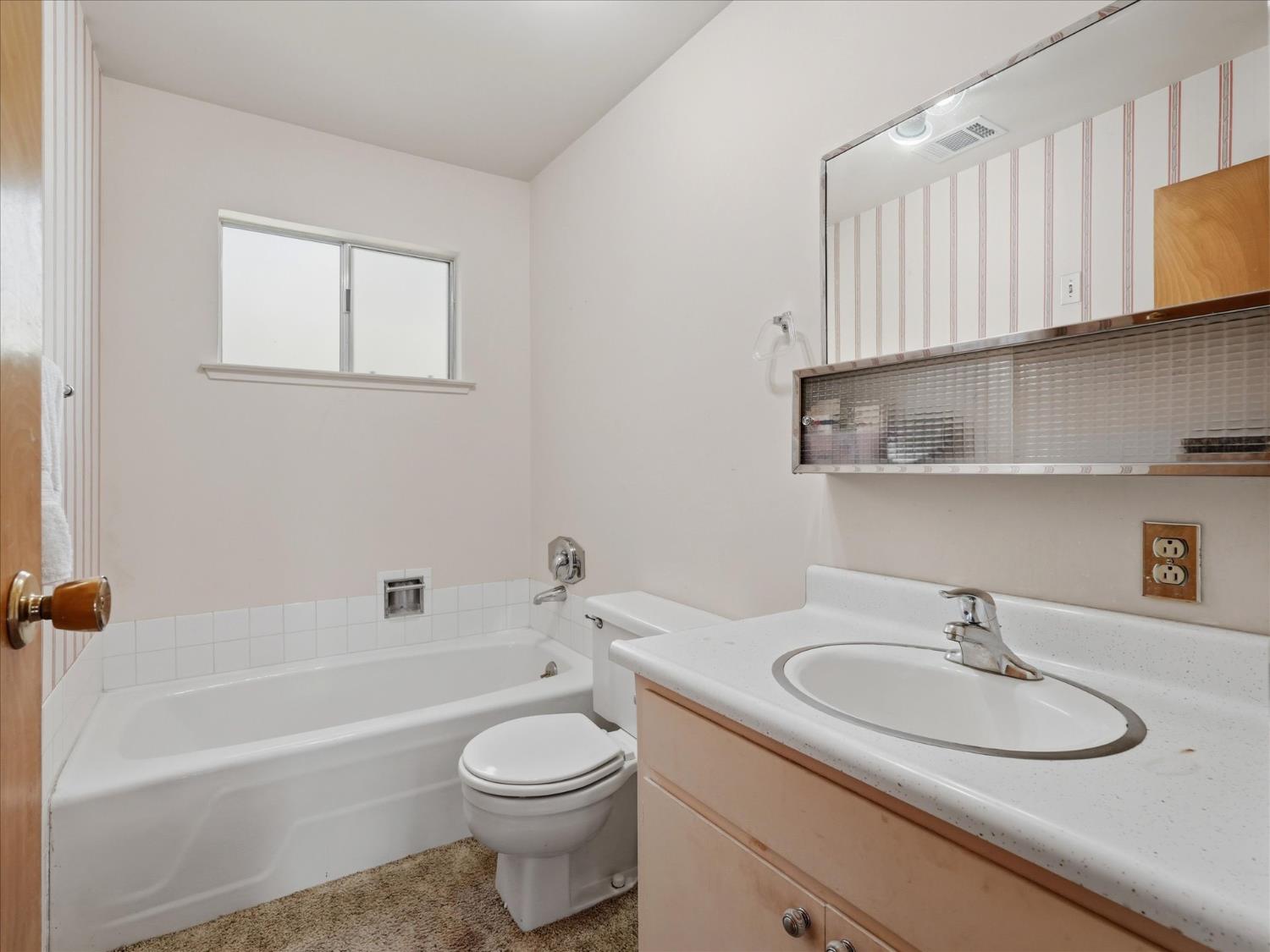 45167 Tolladay Road Oakhurst, CA 93644 - Photo 21 of 50 a bathroom with a sink a toilet and bathtub