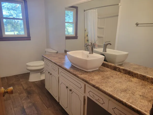 a bathroom with a bathtub and shower