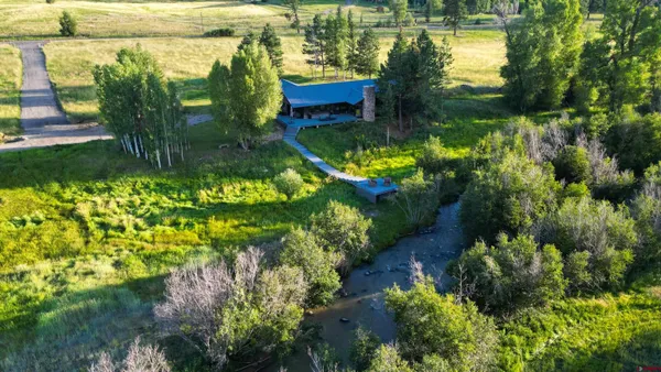 a view of a garden with a lake
