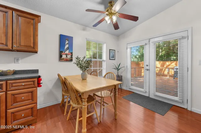 a view of backyard with a deck and wooden floor