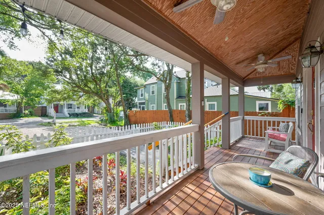 a kitchen with stainless steel appliances granite countertop a sink and a stove top oven with wooden floor