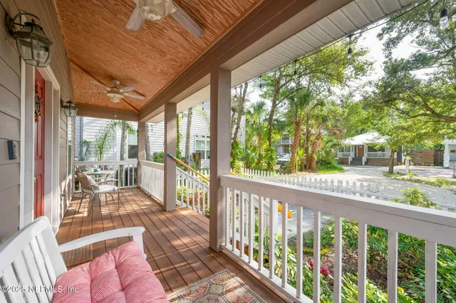 a kitchen with stainless steel appliances granite countertop a refrigerator a stove and a sink with wooden floor