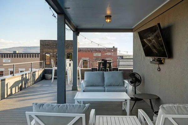 a view of a chairs and table on the terrace