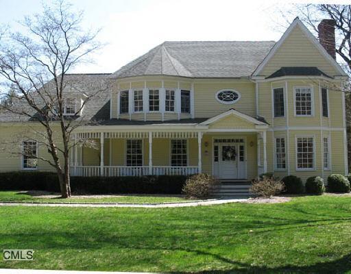 215 Lyons Plain Road Weston, CT 06883 - Photo 1 of 1 a front view of a house with a garden