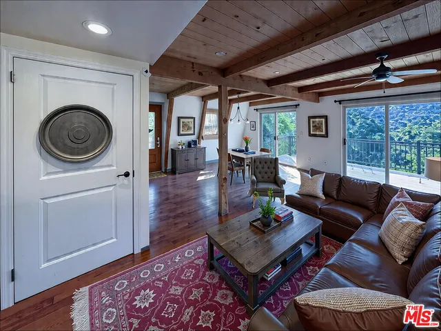 a living room with furniture a fireplace and a table