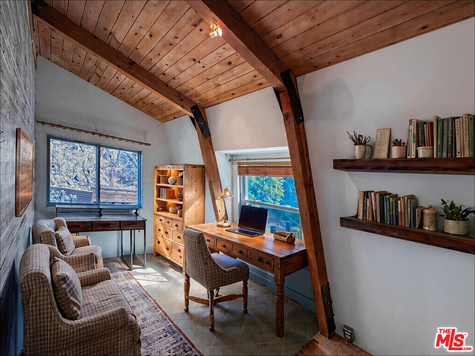 2445 Burson Road Topanga, CA 90290 - Photo 7 of 14 a work room with furniture and book shelf