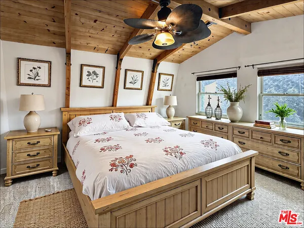 a bed room with a bed and a window