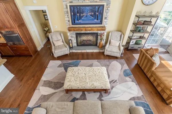 a bedroom with a bed and a lamp on dresser
