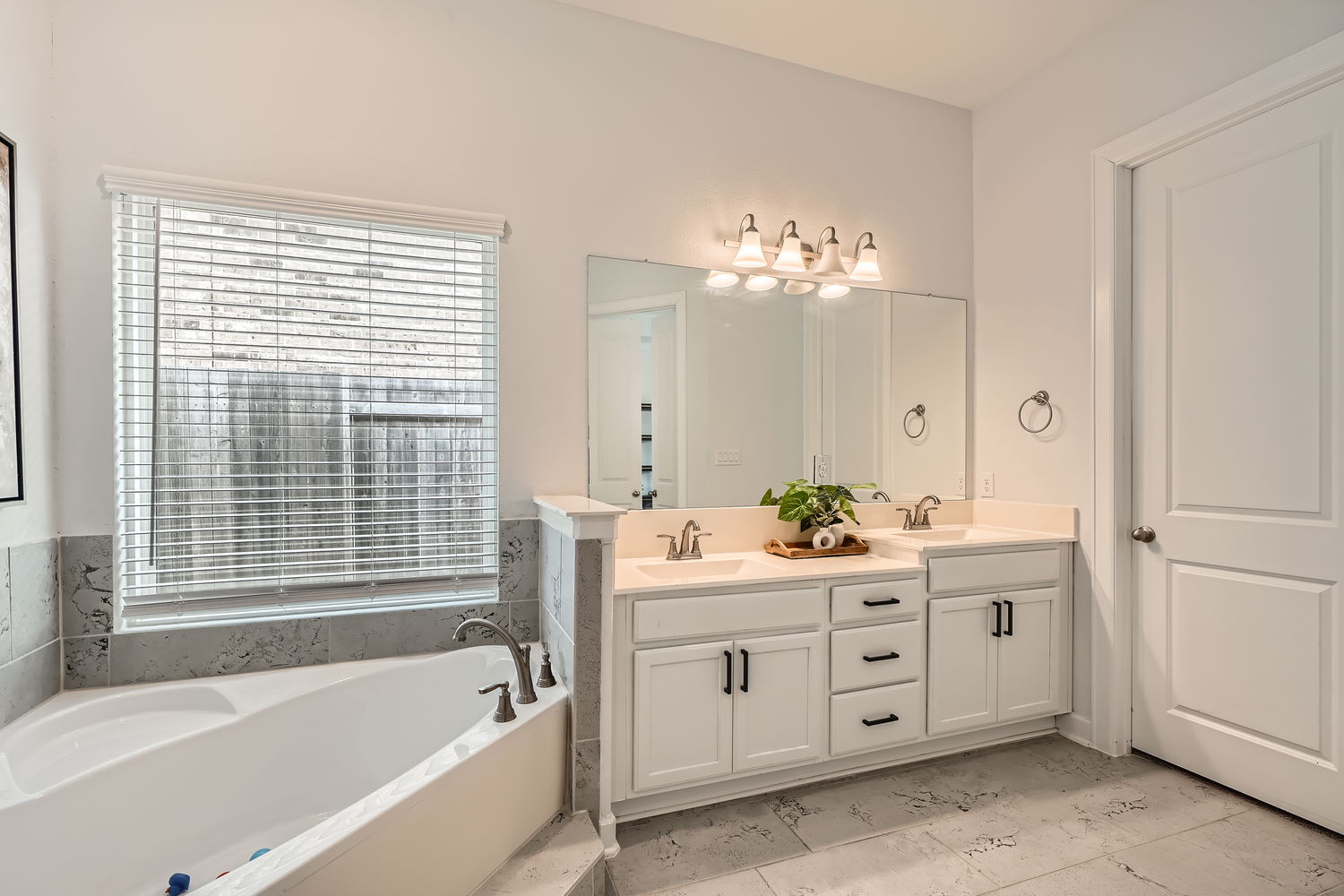 582 Wild Pecan Loop Buda, TX 78610 - Photo 13 of 28 Full bath featuring double vanity and a bath