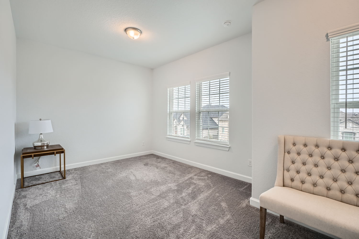 582 Wild Pecan Loop Buda, TX 78610 - Photo 18 of 28 Unfurnished room with baseboards and carpet floors