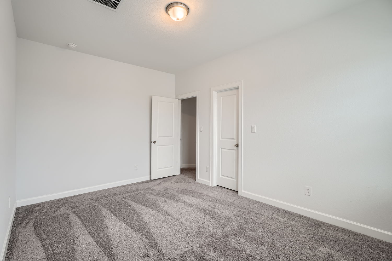 582 Wild Pecan Loop Buda, TX 78610 - Photo 21 of 28 Unfurnished room featuring carpet floors and baseboards