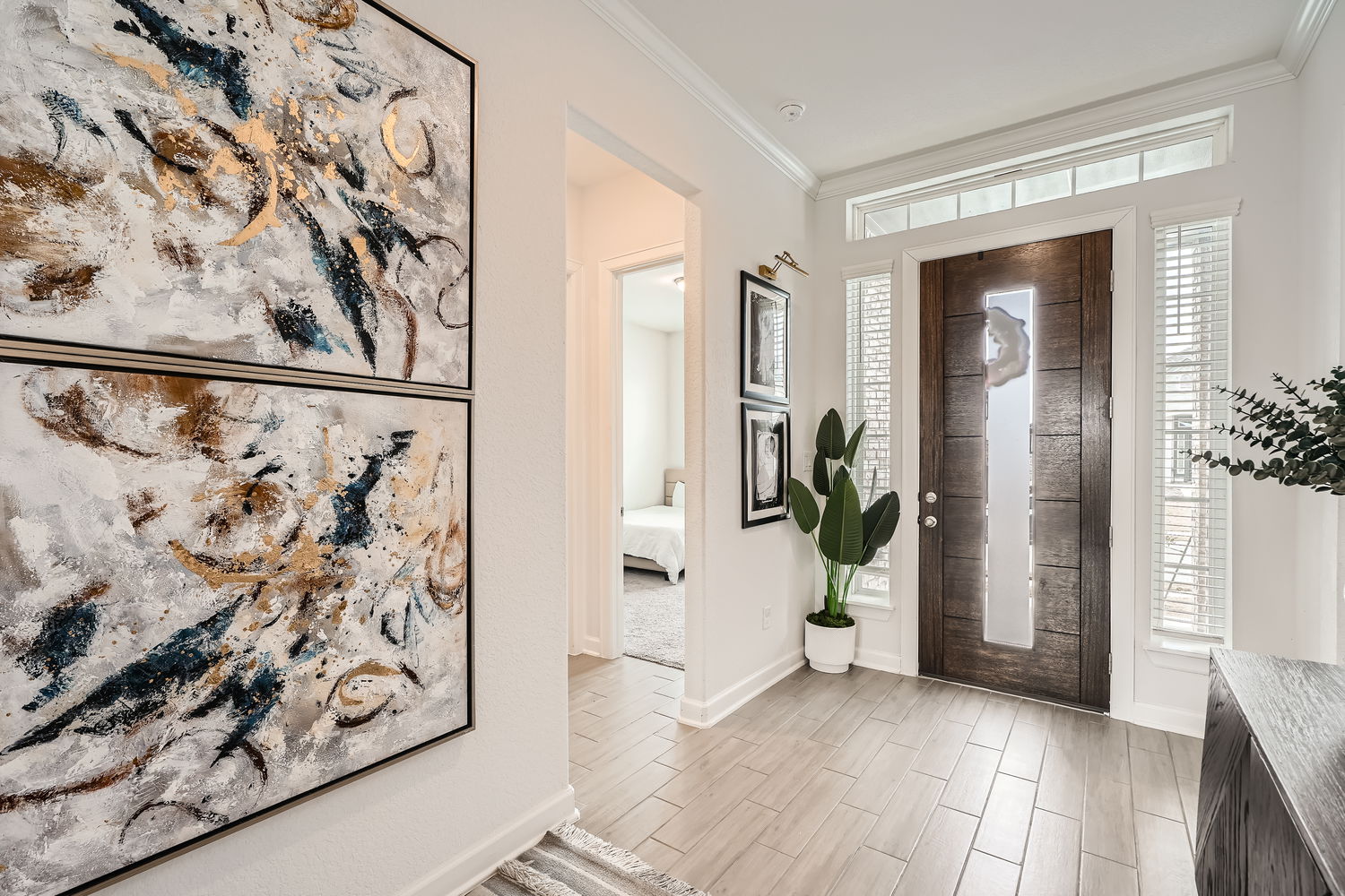 582 Wild Pecan Loop Buda, TX 78610 - Photo 4 of 28 Foyer entrance featuring crown molding and wood finish floors