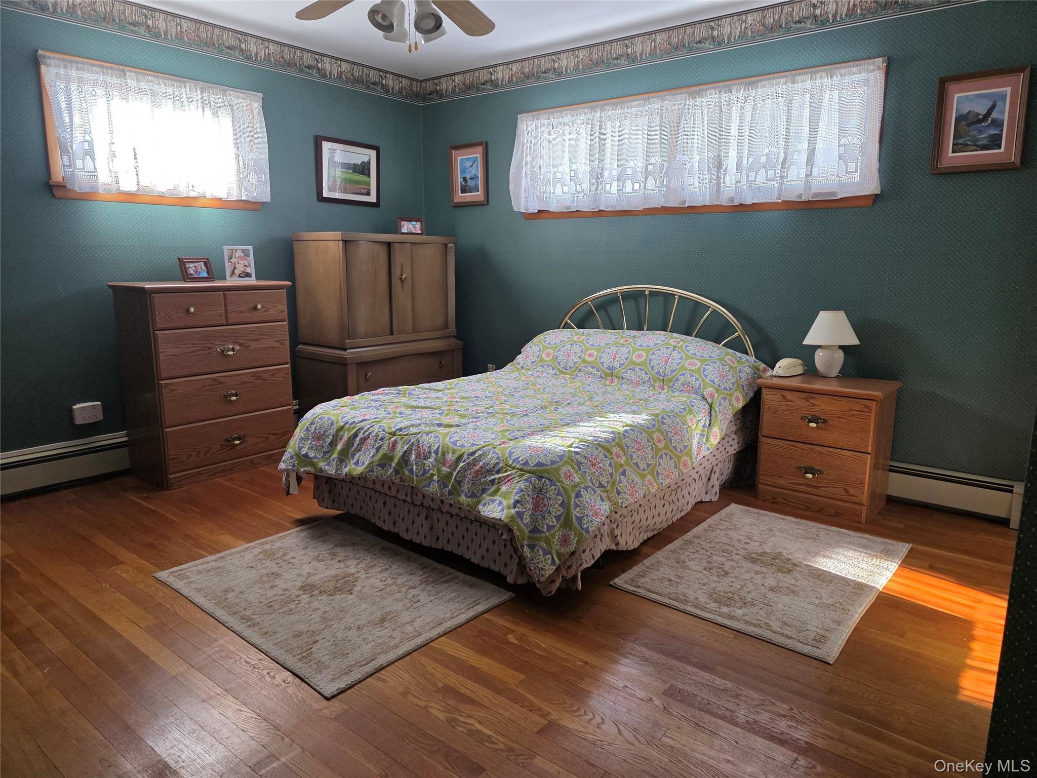 94 Whangtown Road Carmel, NY 10512 - Photo 10 of 12 Second Bedroom featuring multiple windows and wood flooring,