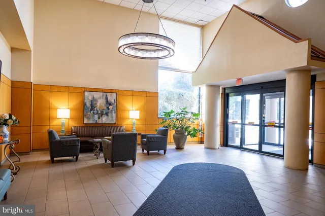 a view of a livingroom with furniture window and wooden floor