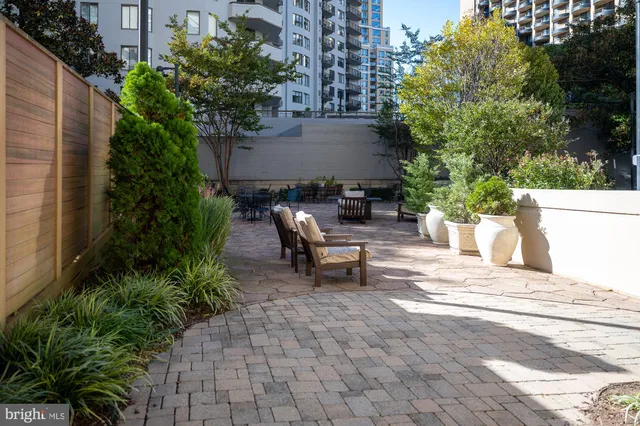 a view of a patio with table and chairs and potted plants
