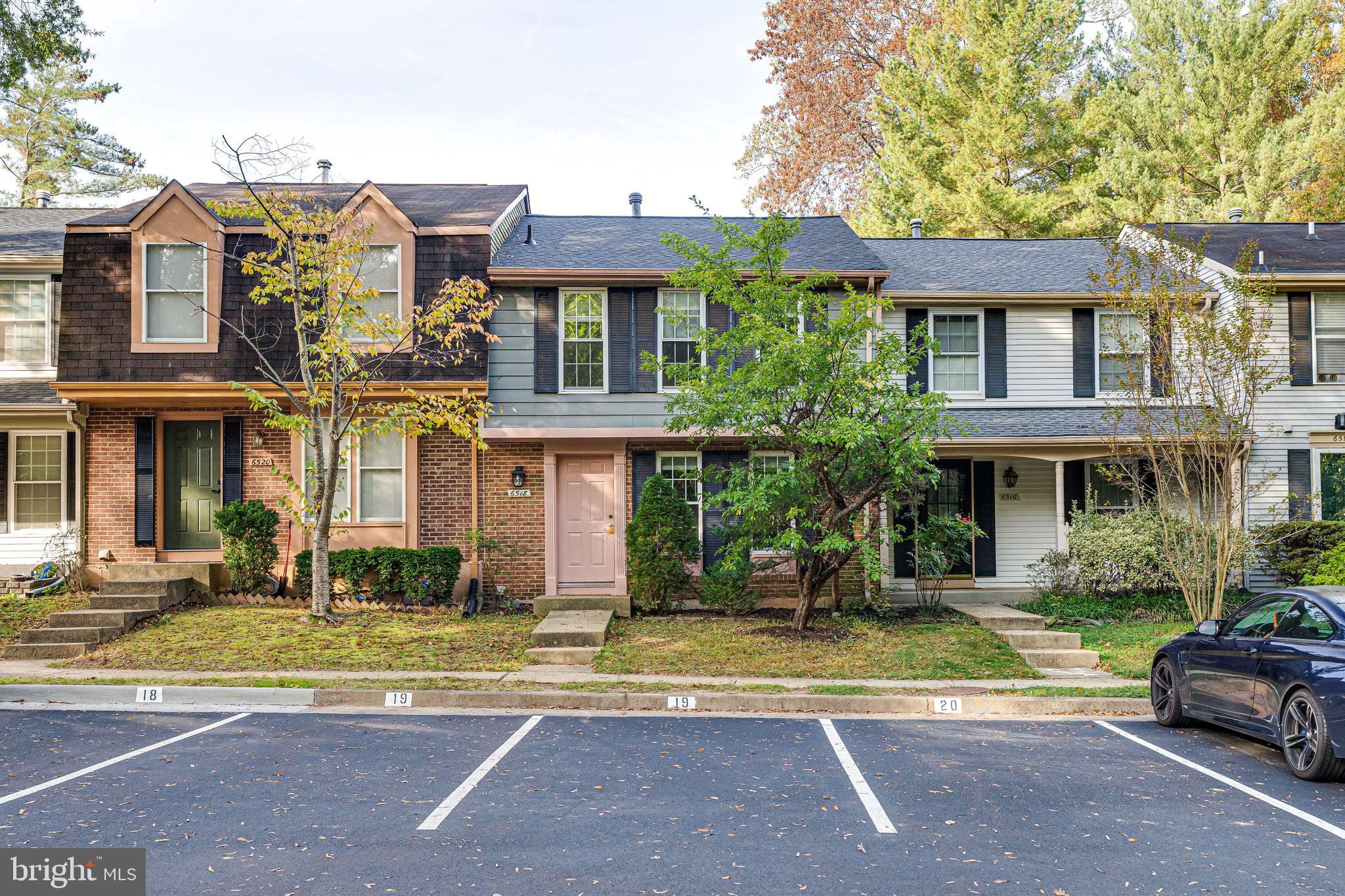 6518 Alexis Lane Springfield, VA 22152 - Photo 1 of 44 a front view of a residential apartment building with a yard