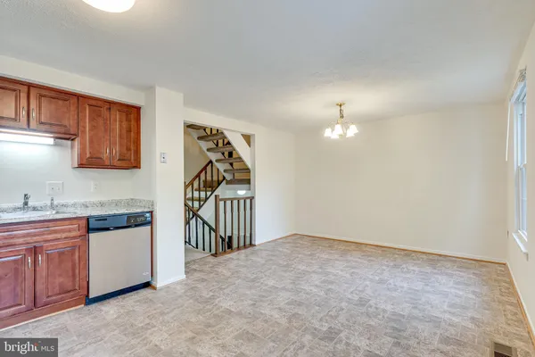 a very nice looking room with a view of kitchen