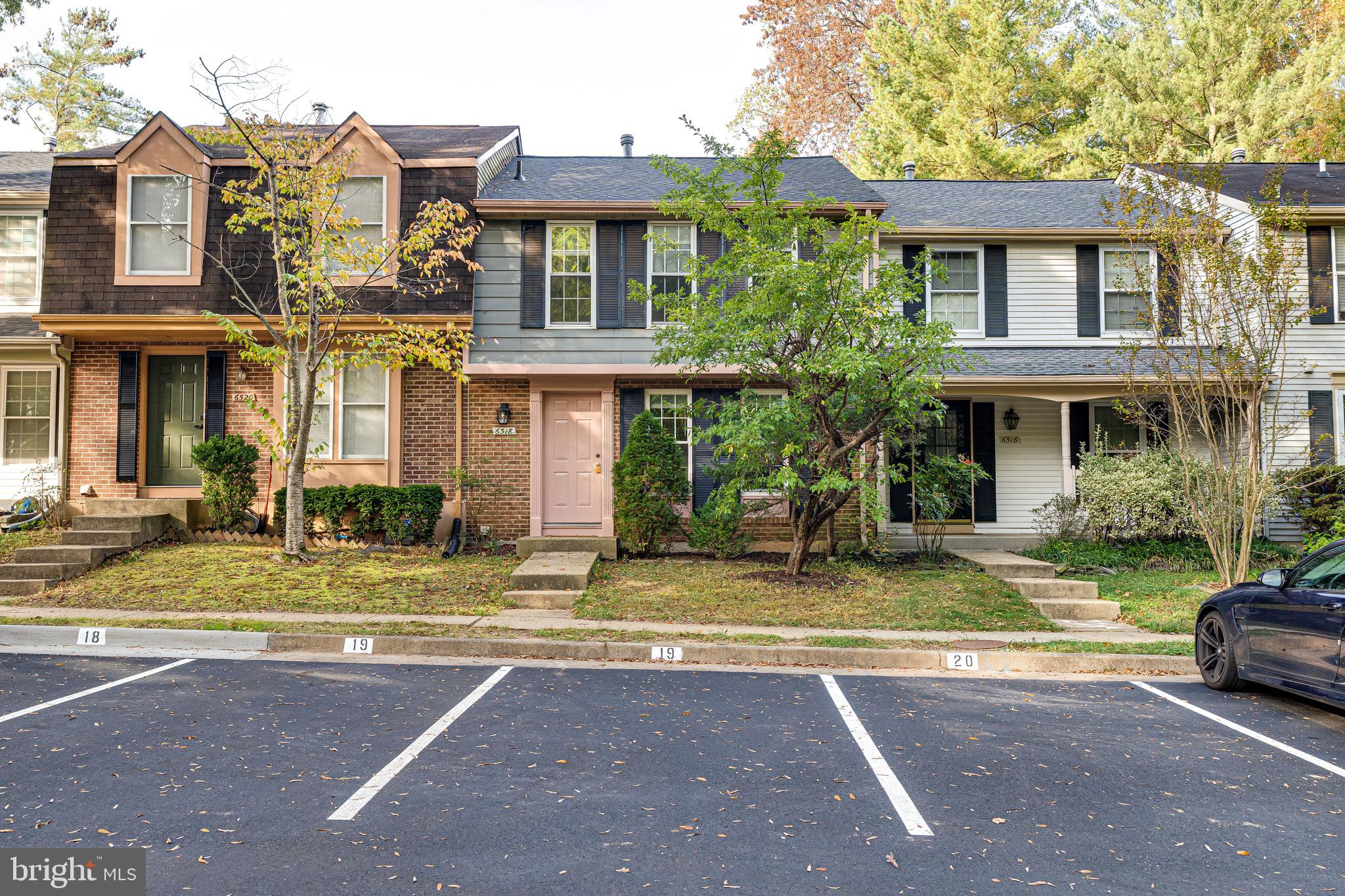 6518 Alexis Lane Springfield, VA 22152 - Photo 2 of 44 a view of a white house with large windows next to a road