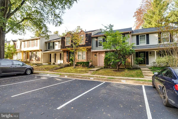 a view of a parked cars in front of a building