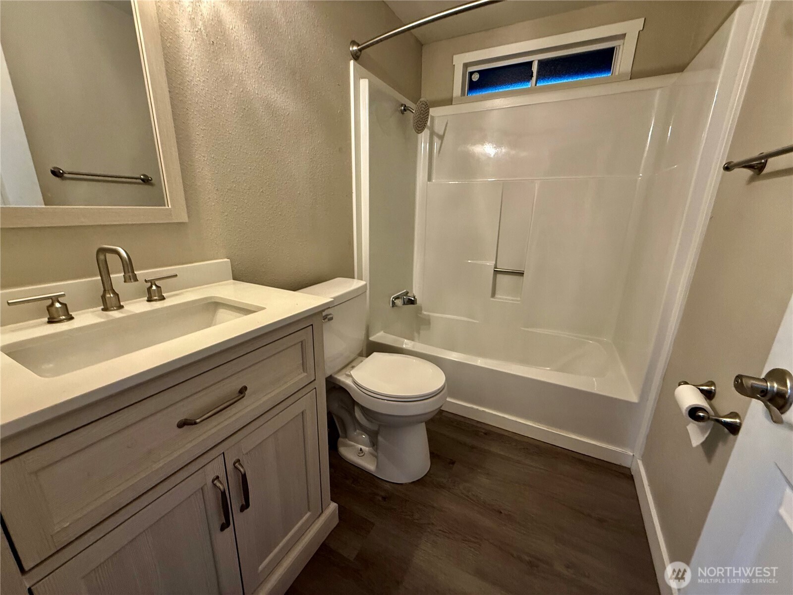 1040 Northeast Larson Boulevard Belfair, WA 98528 - Photo 15 of 18 a bathroom with a sink a toilet and a mirror
