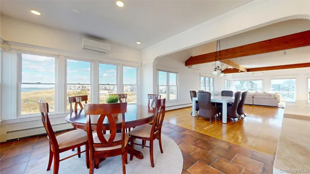 a kitchen with stainless steel appliances granite countertop white cabinets a stove a refrigerator and a sink