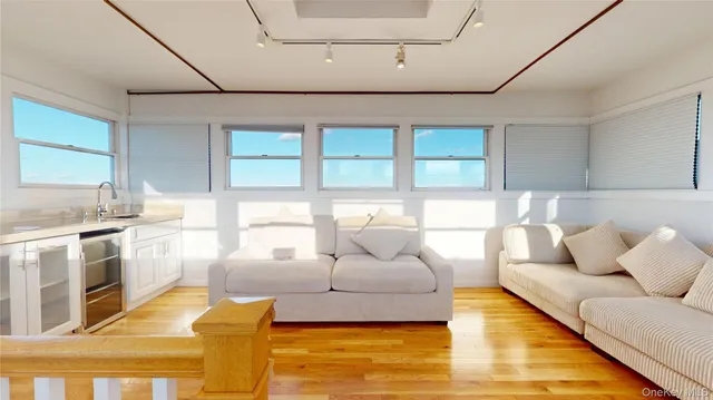 a living room with large windows