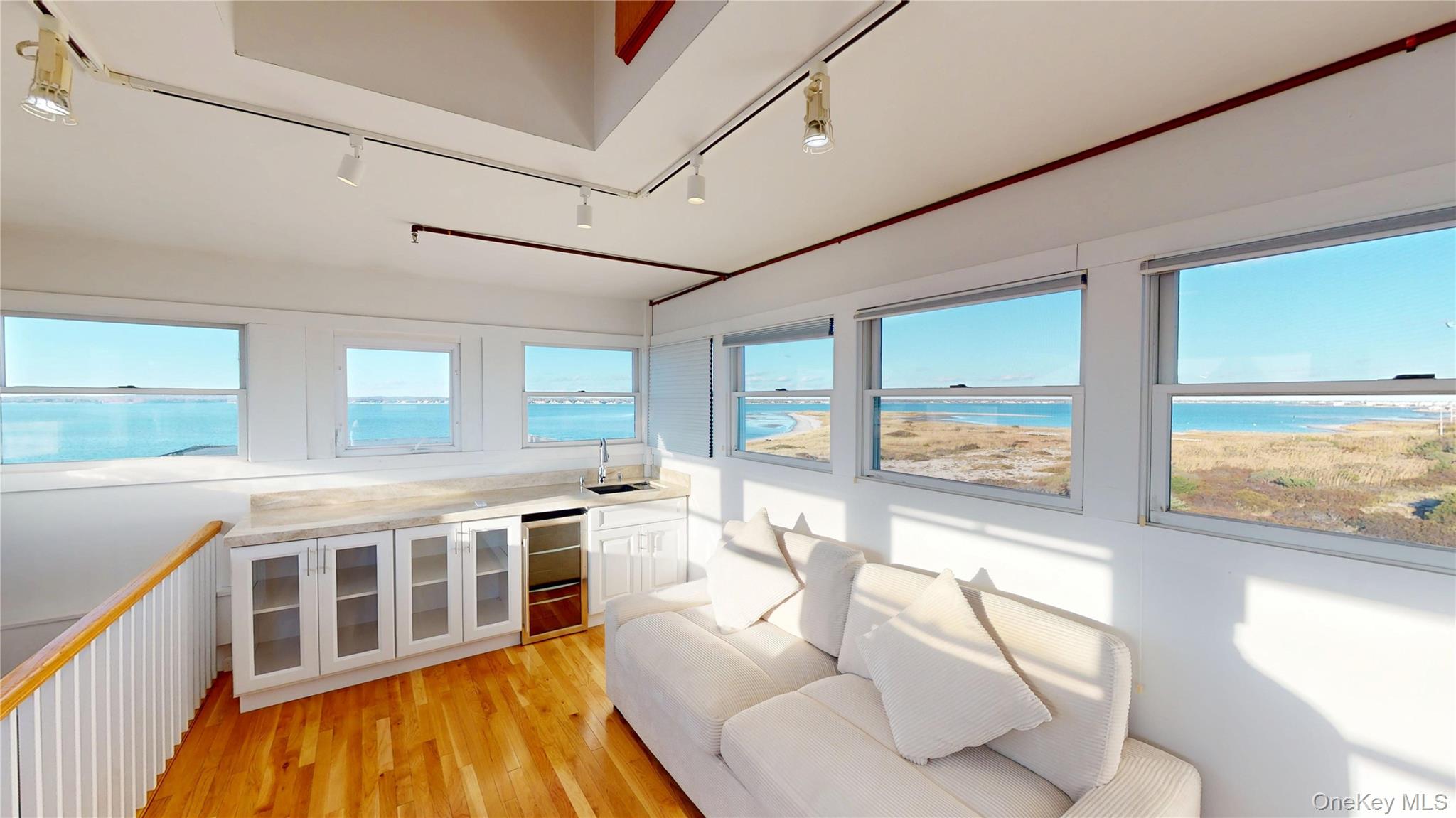 750 Dune Road West Hampton Dunes, NY 11978 - Photo 26 of 49 a living room with large windows